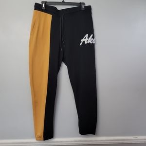 AKOO SCRIPT BLACK AND ORANGE JOGGER